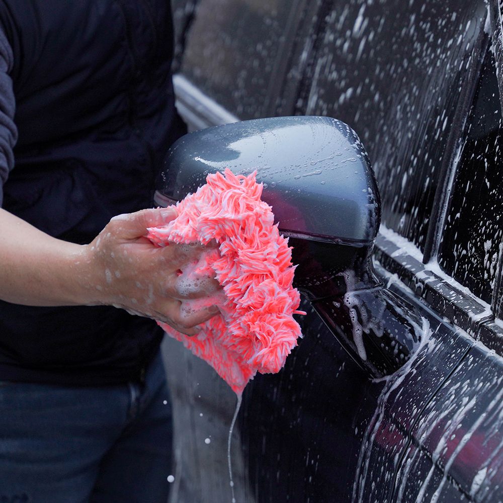 Purestar Creamy Wash washandje met polsband neon peach