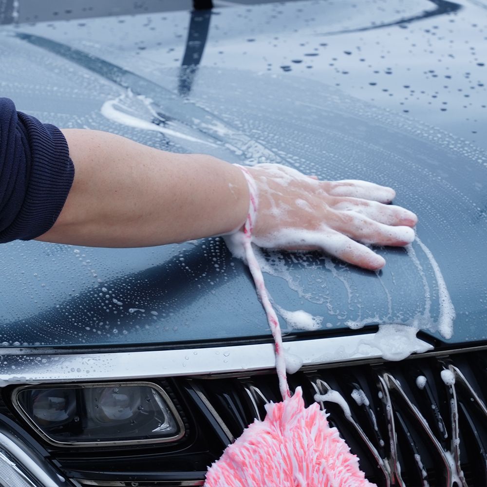 Purestar Creamy Wash washandje met polsband neon peach